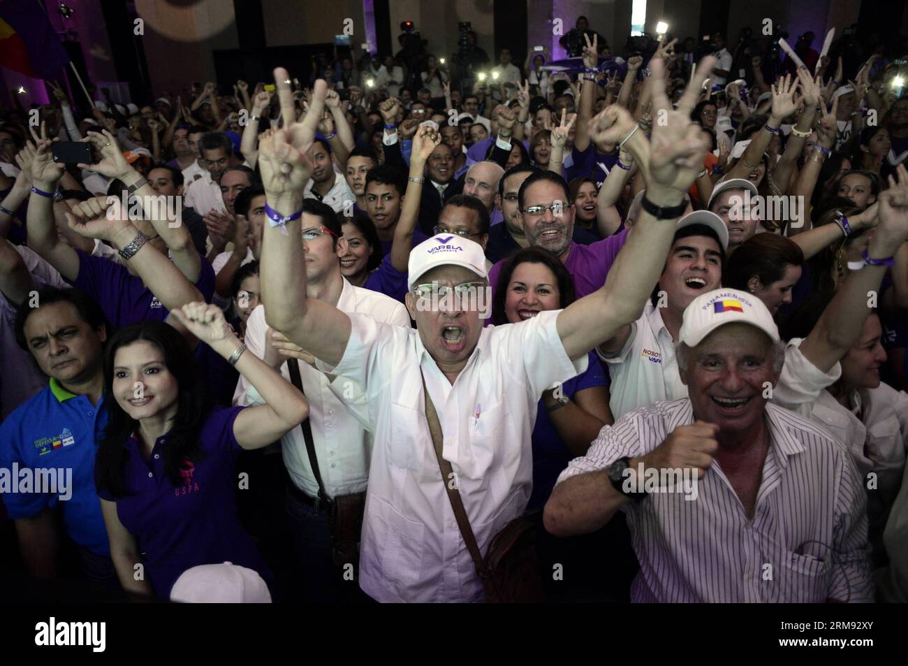 PANAMA CITY, May 4, 2014 (Xinhua) -- Supporters of presidential candidate Juan Carlos Varela from the Panamenista Party react after the preliminary results of the general elections, in Panama City, capital of Panama, on May 4, 2014. President of the Supreme Electoral Court Erasmo Pinilla said on Sunday night that Juan Carlos Varela is the virtual winner of Panama s presidency.(Xinhua/Mauricio Valenzuela) PANAMA-PANAMA CITY-POLITICS-ELECTIONS PUBLICATIONxNOTxINxCHN   Panama City May 4 2014 XINHUA Supporters of Presidential Candidate Juan Carlos Varela from The  Party react After The preliminary Stock Photo