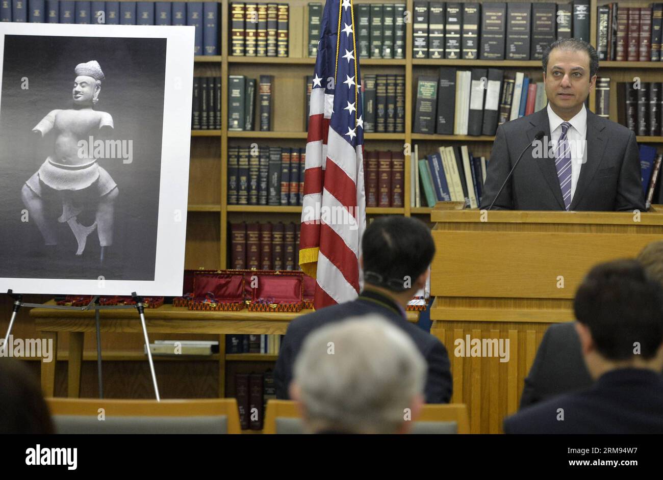 Preet Bharara, the U.S. Attorney for the southern District of New York, speaks at a handover ceremony of the ancient statue of Duryodhana in New York, the United States, May 7, 2014. The Duryodhana, a 10th Century sandstone sculpture, which alleged to be stolen from the Prasat Chen temple at Koh Ker by an organized looting network, and ultimately imported into U.S. for sale by Sotheby s Inc.. In April 2012, the U.S. Attorney filed a court action in Federal Court seeking forfeiture of the statue and handing back to Cambodia. In December 2013, Sotheby s decided to settle the case by agreeing to Stock Photo