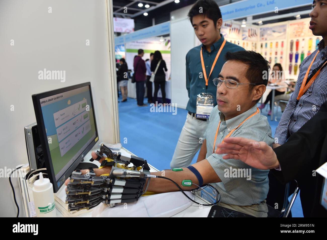 A visitor experiences an exhibited medical device at Hong Kong