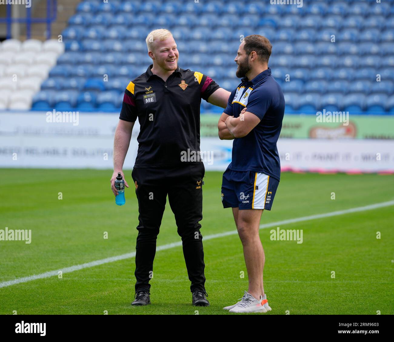 Matty English #15 of Huddersfield Giants speaks with Aidan Sezer #7 of  Leeds Rhinos before the Betfred Super League Round 23 match Huddersfield  Giants vs Leeds Rhinos at John Smiths Stadium, Huddersfield,