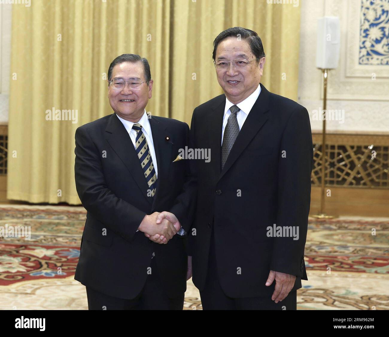 (140509) -- BEIJING, May 9, 2014 (Xinhua) -- Yu Zhengsheng (R), chairman of the National Committee of the Chinese People s Political Consultative Conference, meets with a group of Japanese lawmakers led by Takeshi Noda (L), the veteran Liberal Democratic Party (LDP) lawmaker, in Beijing, capital of China, May 9, 2014. (Xinhua/Pang Xinglei) (yxb) CHINA-BEIJING-YU ZHENGSHENG-JAPAN-MEETING (CN) PUBLICATIONxNOTxINxCHN   Beijing May 9 2014 XINHUA Yu Zheng Sheng r Chairman of The National Committee of The Chinese Celebrities S Political Consultative Conference Meets With a Group of Japanese lawmaker Stock Photo