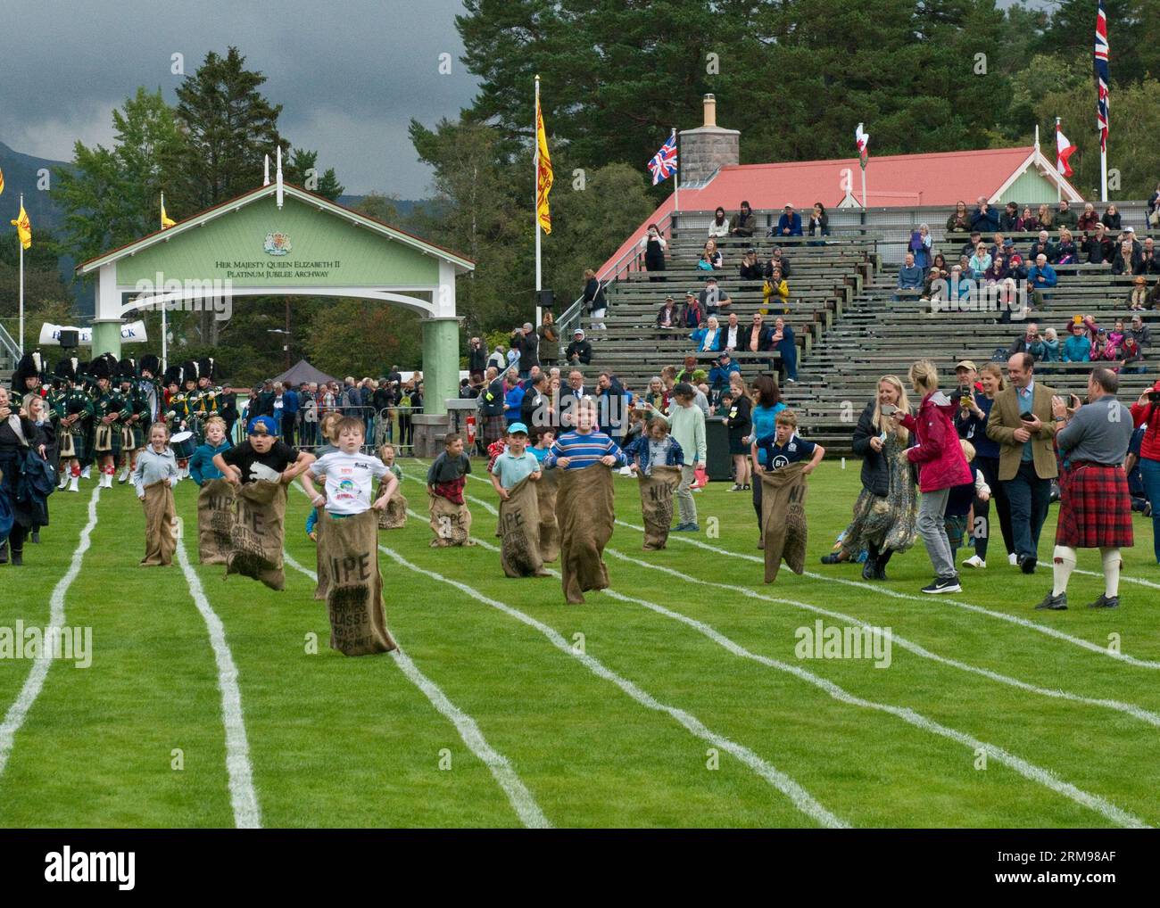 Childrens sack race. Braemar Highland Games, Aberdeenshire Stock Photo