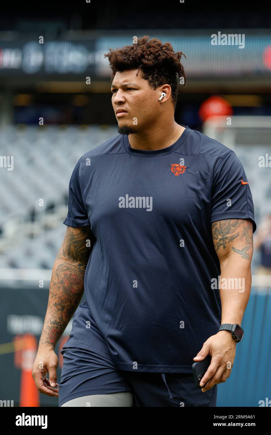 Chicago Bears offensive tackle Aviante Collins (74) blocks against the Tennessee  Titans during the first half of an NFL preseason football game, Saturday,  Aug. 12, 2023, in Chicago. (AP Photo/Kamil Krzaczynski Stock