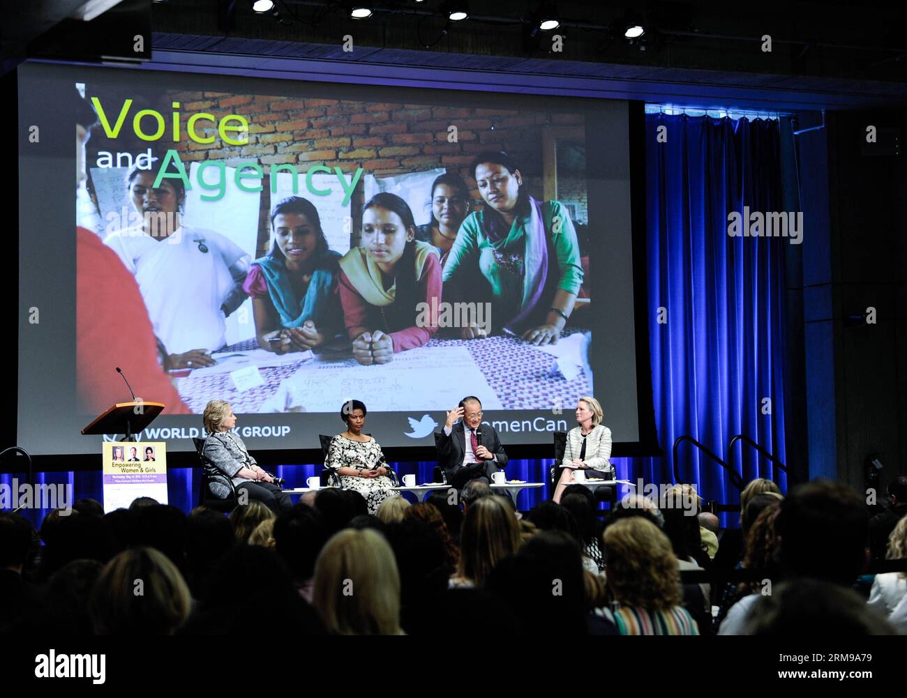 WASHINGTON D.C., May 14, 2014 - World Bank Group President Jim Yong Kim (2nd R) speaks at the launch ceremony of World Bank Group s new report Voice and Agency: Empowering Women and Girls for Shared Prosperity finds in Washington D.C., capital of the United States, May 14, 2014. Girls with little or no education are far more likely to be married as children, suffer domestic violence, live in poverty, and lack a say over household spending or their own health care than better-educated peers, according to the new report by the World Bank Group on Wednesday. (Xinhua/Bao Dandan) US-WASHINGTON-WORL Stock Photo
