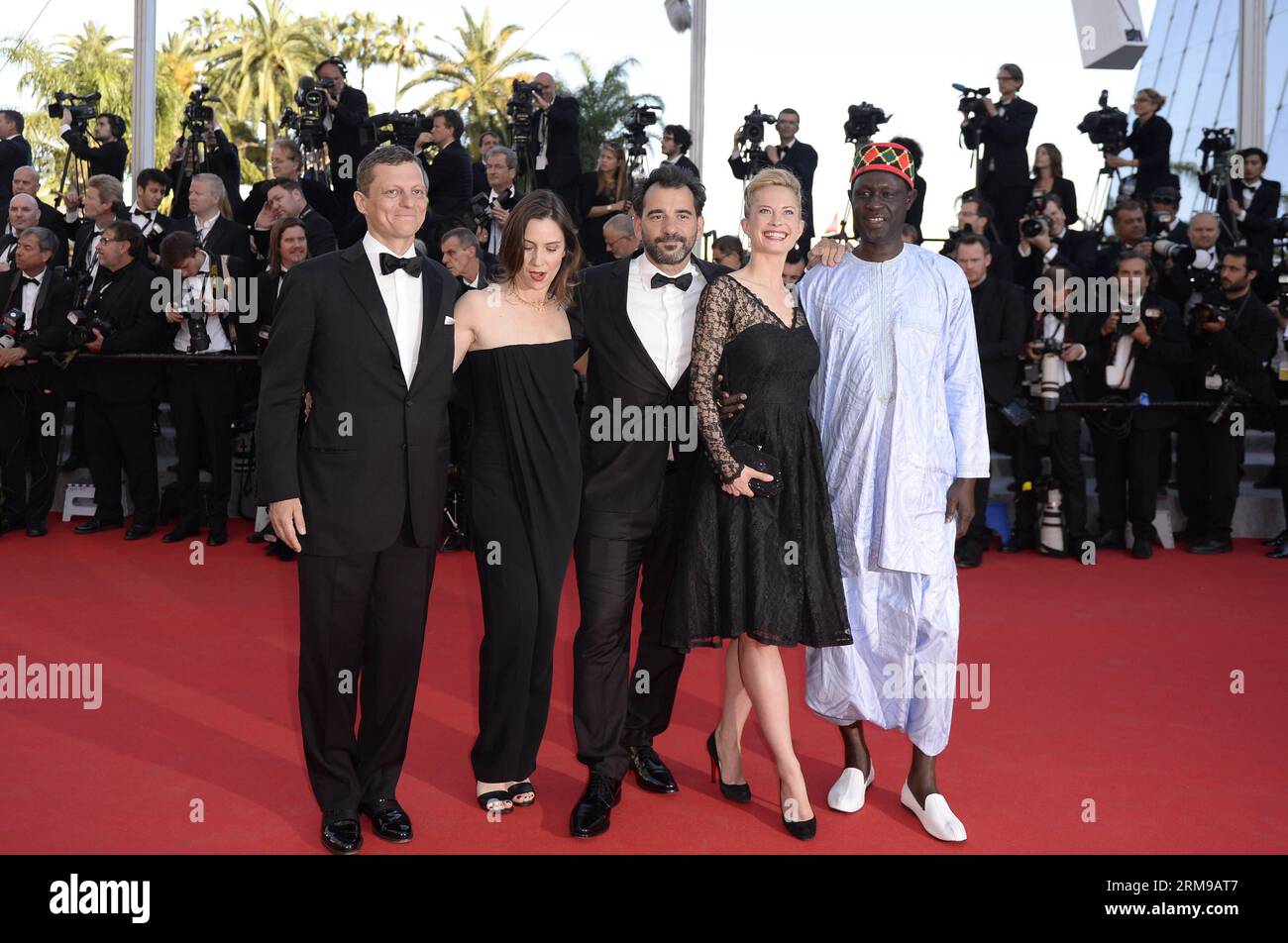 (140515) -- CANNES, May 15, 2014 (Xinhua) -- President of the Criterion Collection Peter Becker, French actress Geraldine Pailhas, Argentinian director Pablo Trapero, Norwegian-Swedish actress Maria Bonnevie and Senegalese director Moussa Toure (from L to R) arrive for the screening of Mr Turner during the 67th Cannes Film Festival, in Cannes, France, May 15, 2014. The movie is presented in the Official Competition of the festival which runs from May 14 to 25. (Xinhua/Ye Pingfan) FRANCE-CANNES-FILM FESTIVAL-MR TURNER-RED CARPET PUBLICATIONxNOTxINxCHN   Cannes May 15 2014 XINHUA President of Th Stock Photo