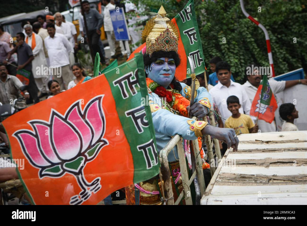 (140517) -- VISAKHAPATNAM, May 17, 2014 (Xinhua) -- A supporter of India s main opposition Bharatiya Janata Party (BJP) attends a parade in Visakhapatnam of Andra Pradesh, India, May 17, 2014. BJP Friday created history by winning the general elections by a landslide, the most resounding victory by any party in the last 30 years, decimating the Nehru-Gandhi dynasty-led ruling Congress Party. (Xinhua/Zheng Huansong) INDIA-VISAKHAPATNAM-BJP-CELEBRATION PUBLICATIONxNOTxINxCHN   May 17 2014 XINHUA a Supporter of India S Main Opposition Bharatiya Janata Party BJP Attends a Parade in  of Andra Prade Stock Photo