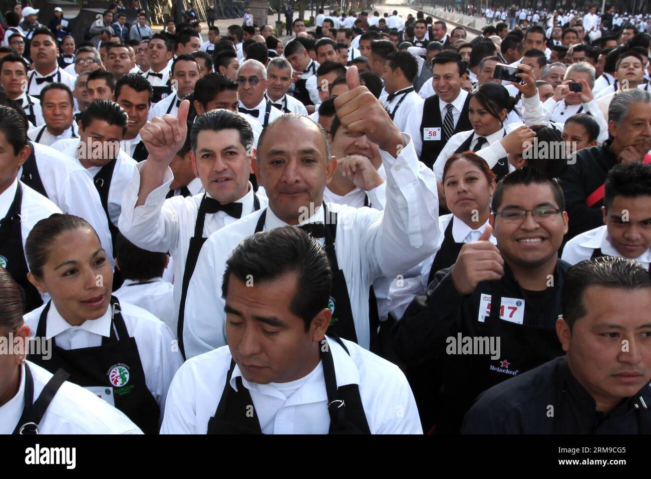 Waiters pose during the Chef s Festival in Mexico City, capital of Mexico, on May 17, 2014. During the festival, two Guinness World Records were broken, one for the biggest chefs concentration in a single place, and another for the largest number of waiters participating in a race with a tray in hand, according to local press. (Xinhua/Raul Hernandez) MEXICO-MEXICO CITY-CHEFS-RECORD PUBLICATIONxNOTxINxCHN   Waiters Pose during The Boss S Festival in Mexico City Capital of Mexico ON May 17 2014 during The Festival Two Guinness World Records Were Broken One for The Biggest Chiefs Concentration in Stock Photo