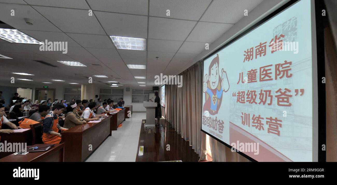 (140523) -- CHANGSHA, May 23, 2014 (Xinhua) -- Fathers have a class about taking care of babies at a Super Daddy Training Camp at Hunan Provincial Children Hospital in Changsha, capital of central China s Hunan Province, May 23, 2014. A total of 40 daddies took part in the camp and they would learn baby nurturing skills in a short time under the guidance of paediatricians. (Xinhua/Long Hongtao) (lfj) CHINA-HUNAN-CHANGSHA-SUPER DADAY TRAINING CAMP (CN) PUBLICATIONxNOTxINxCHN   Changsha May 23 2014 XINHUA Fathers have a Class About Taking Care of Babies AT a Super Daddy Training Camp AT Hunan Pr Stock Photo
