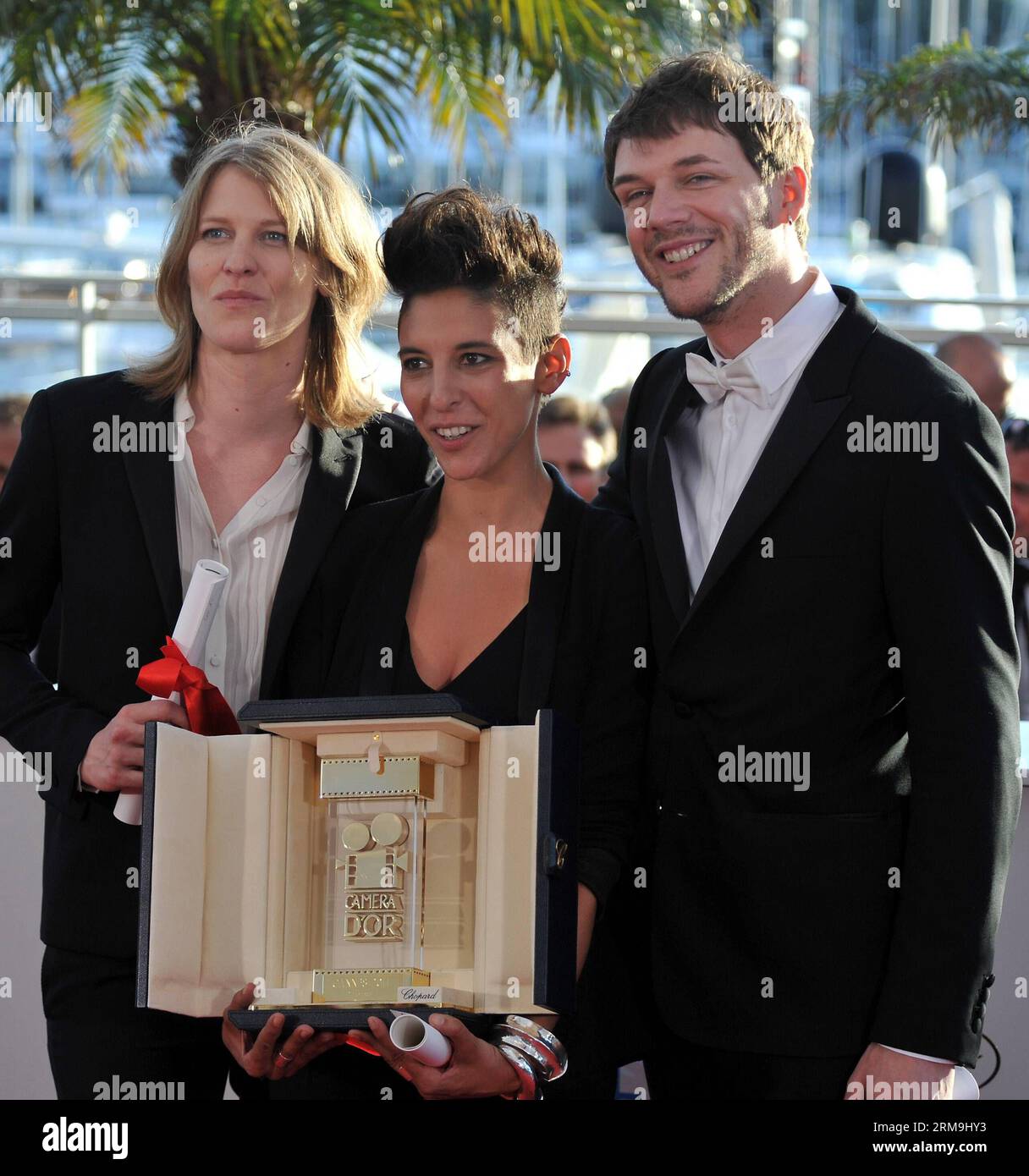 (140524) -- CANNES, May 24, 2014 (Xinhua) -- French directors Marie Amachoukeli, Claire Burger and Samuel Theis (L to R) present the Camera d Or prize of the 67th Cannes Film Festival for the film Party Girl, in Cannes, France, May 24, 2014.(Xinhua/Chen Xiaowei) FRANCE-CANNES-FILM FESTIVAL-AWARDS PUBLICATIONxNOTxINxCHN   Cannes May 24 2014 XINHUA French Directors Marie  Claire Burger and Samuel Theis l to r Present The Camera D or Prize of The 67th Cannes Film Festival for The Film Party Girl in Cannes France May 24 2014 XINHUA Chen Xiaowei France Cannes Film Festival Awards PUBLICATIONxNOTxIN Stock Photo