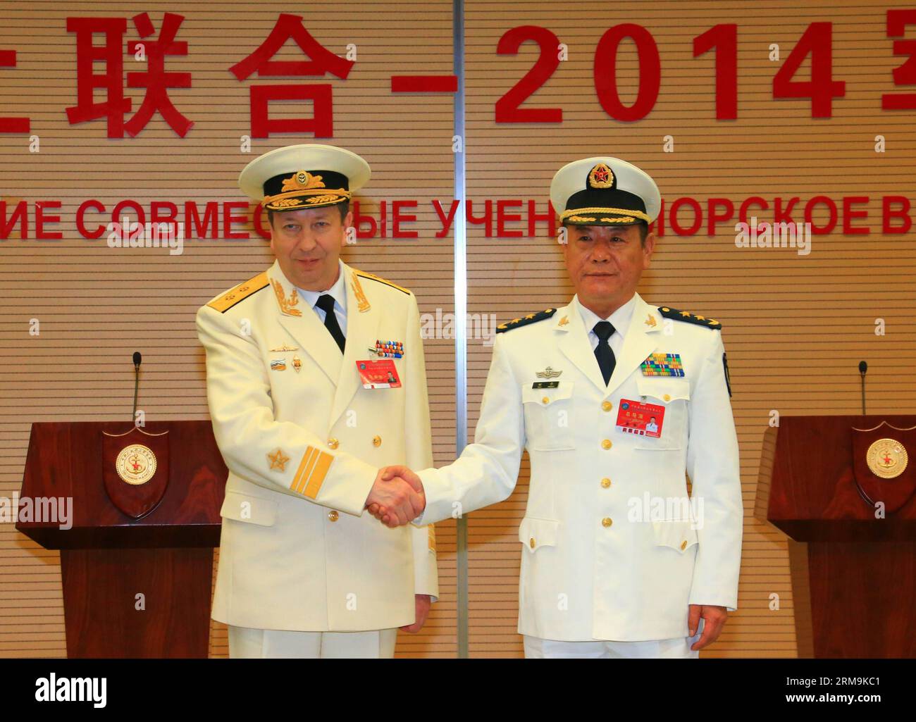 Tian Zhong (R), deputy commander of the Chinese Navy and the Chinese director of the Joint Sea-2014 , shakes hands with Fedotenkov, deputy commander of Russian Navy and Russian director of the drill, at the closing ceremony of the China-Russia joint naval drill in Shanghai, east China, May 26, 2014. The directors of two sides announced the end of the drill here on Monday. (Xinhua/Zha Chunming) (zkr) CHINA-SHANGHAI-RUSSIA-JOINT NAVAL DRILL-CLOSE(CN) PUBLICATIONxNOTxINxCHN   Tian Zhong r Deputy Commander of The Chinese Navy and The Chinese Director of The Joint Sea 2014 Shakes Hands With  Deputy Stock Photo