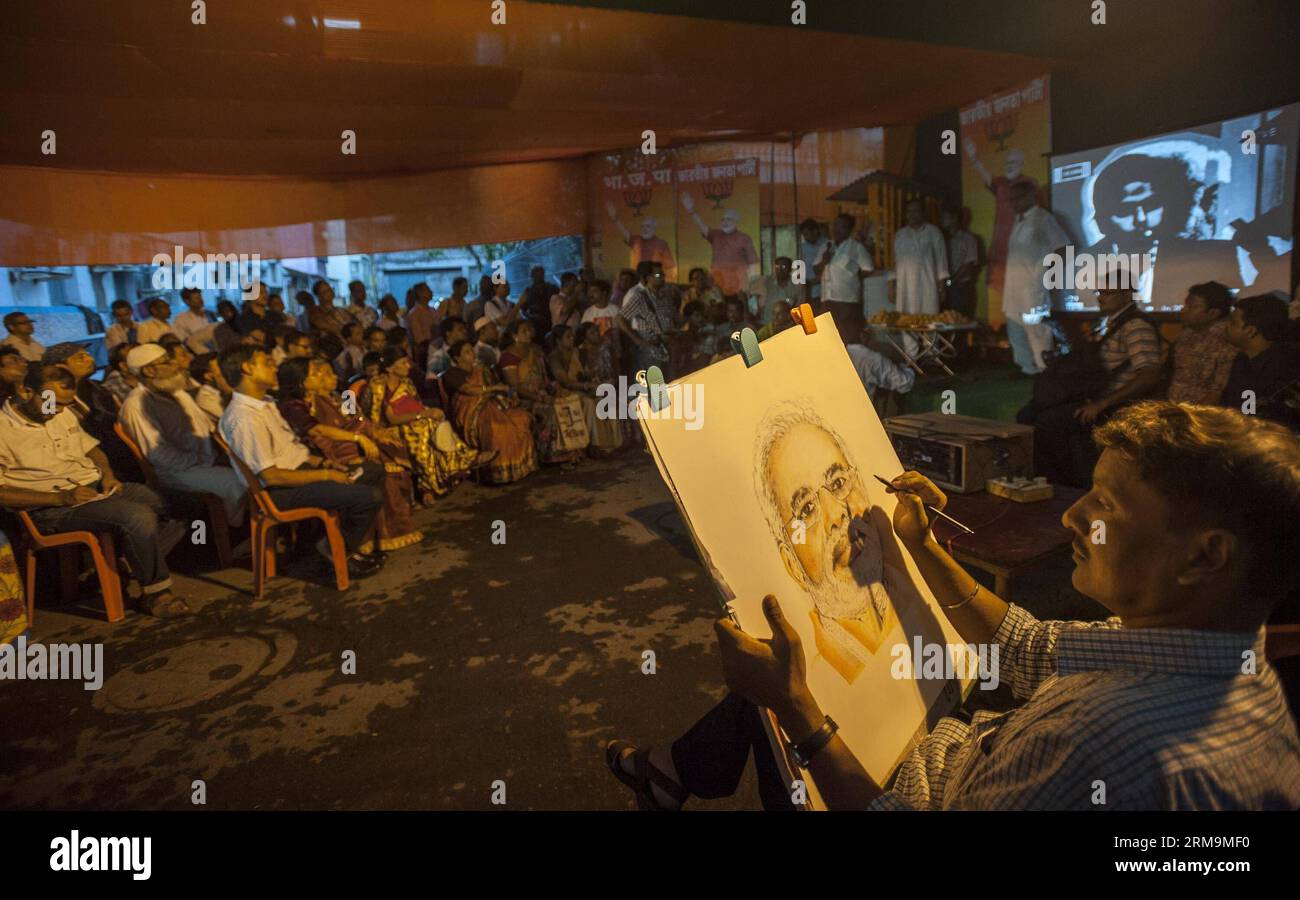 CALCUTTA, May 26, 2014 - An Indian artist sketches Narendra Modi s face as Bharatiya Janata Party (BJP) supporters gather to watch the oath taking ceremony of Modi as India s 15th prime minister in Calcutta, capital of eastern Indian state West Bengal, May 26, 2014. Narendra Modi, the son of a tea-seller, on Monday created history by becoming Indian new prime minister in a grand ceremony attended by his counterpart from arch- rival Pakistan, along with heads of state of other South Asian nations. (Xinhua/Tumpa Mondal) INDIA-CALCUTTA-MODI-CEREMONY PUBLICATIONxNOTxINxCHN   Calcutta May 26 2014 t Stock Photo
