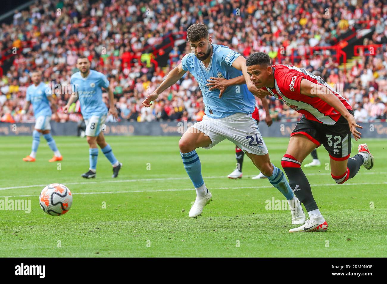 Joško Gvardiol #24 of Manchester City and William Osula #32 of Sheffield United battle for the ball during the Premier League match Sheffield United vs Manchester City at Bramall Lane, Sheffield, United Kingdom, 27th August 2023 (Photo by Gareth Evans/News Images) in, on 8/27/2023. (Photo by Gareth Evans/News Images/Sipa USA) Credit: Sipa USA/Alamy Live News Stock Photo