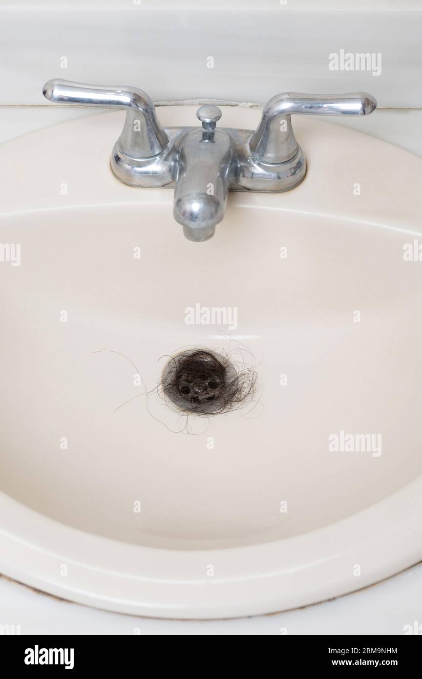 Cleaning from stuck hair sink macro close up view Stock Photo Alamy