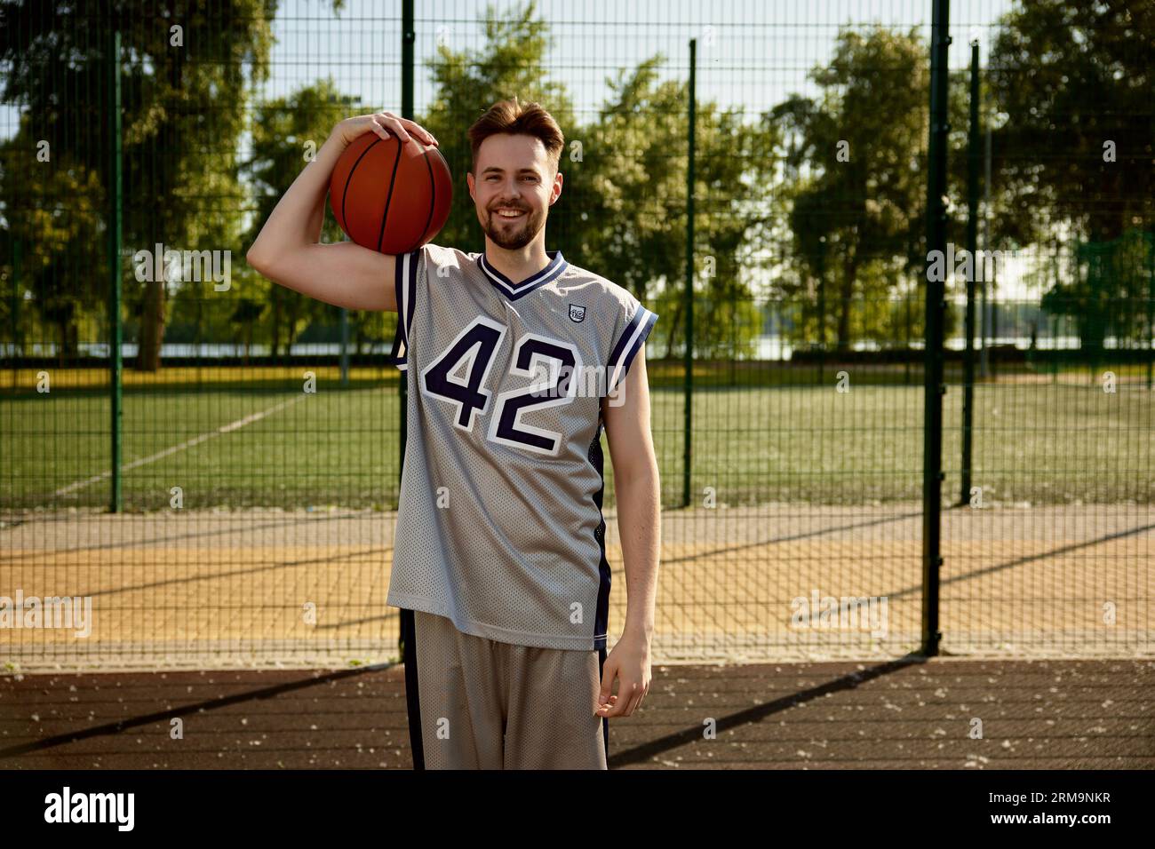 Headshot portrait of smiling happy basketball player Stock Photo