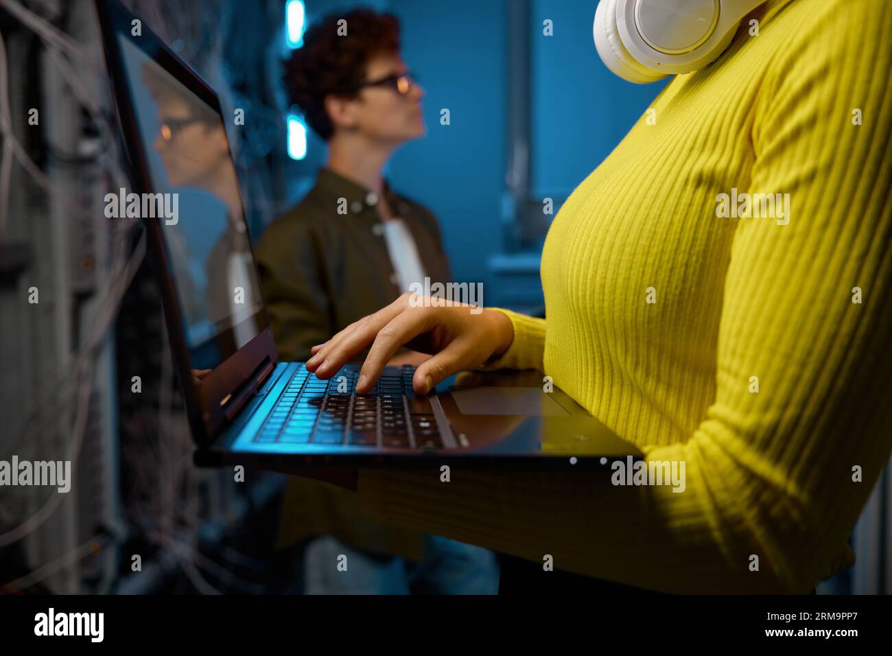 IT technicians working together with network hardware Stock Photo