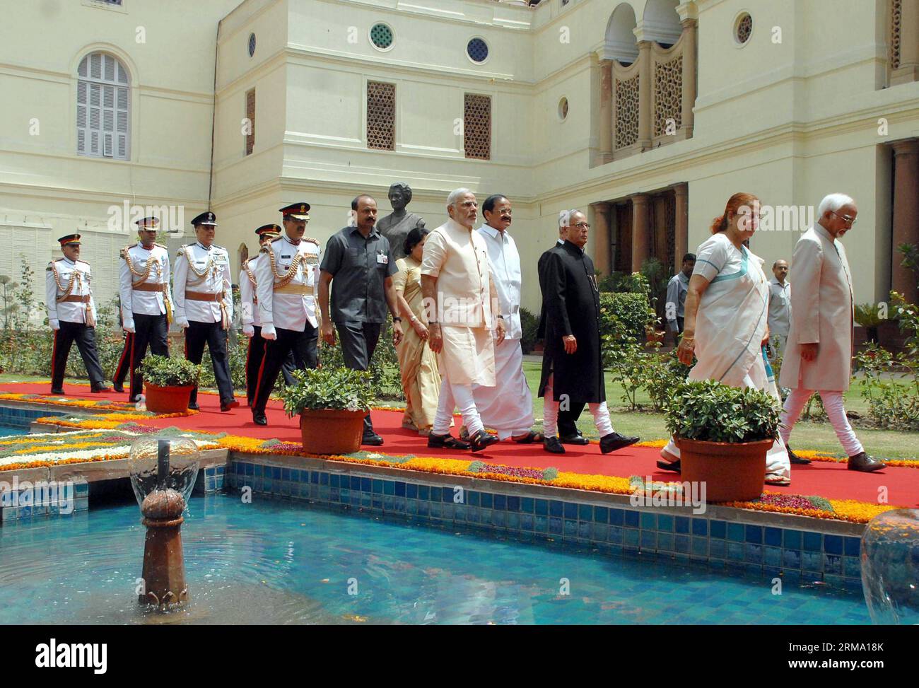 (140609) -- NEW DELHI, June 9, 2014 (Xinhua) -- Indian President Pranab Mukherjee (2nd row R), Indian Vice President Hamid Ansari (R, front), Indian Prime Minister Narendra Modi (2nd row L), Lok Sabha (the Lower House) speaker Sumitra Mahajan (L, front) and others proceed towards Central Hall of the parliament in a procession where President addresses the joint session of Parliament in New Delhi, India, June 9, 2014. (Xinhua) INDIA-NEW DELHI-PALIAMENT PROCESSION PUBLICATIONxNOTxINxCHN   New Delhi June 9 2014 XINHUA Indian President Pranab Mukherjee 2nd Row r Indian Vice President Hamid Ansari Stock Photo