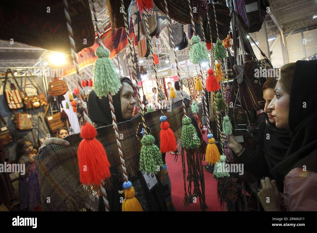 (140613) -- TEHRAN,  (Xinhua) -- People visit the International Handicrafts Exhibition in Tehran, capital of Iran, on June 12, 2014. (Xinhua/Ahmad Halabisaz) (djj) IRAN-TEHRAN-HANDYCRAFT EXHIBITION PUBLICATIONxNOTxINxCHN   TEHRAN XINHUA Celebrities Visit The International Handicrafts Exhibition in TEHRAN Capital of Iran ON June 12 2014 XINHUA Ahmad Halabisaz  Iran TEHRAN handy craft Exhibition PUBLICATIONxNOTxINxCHN Stock Photo