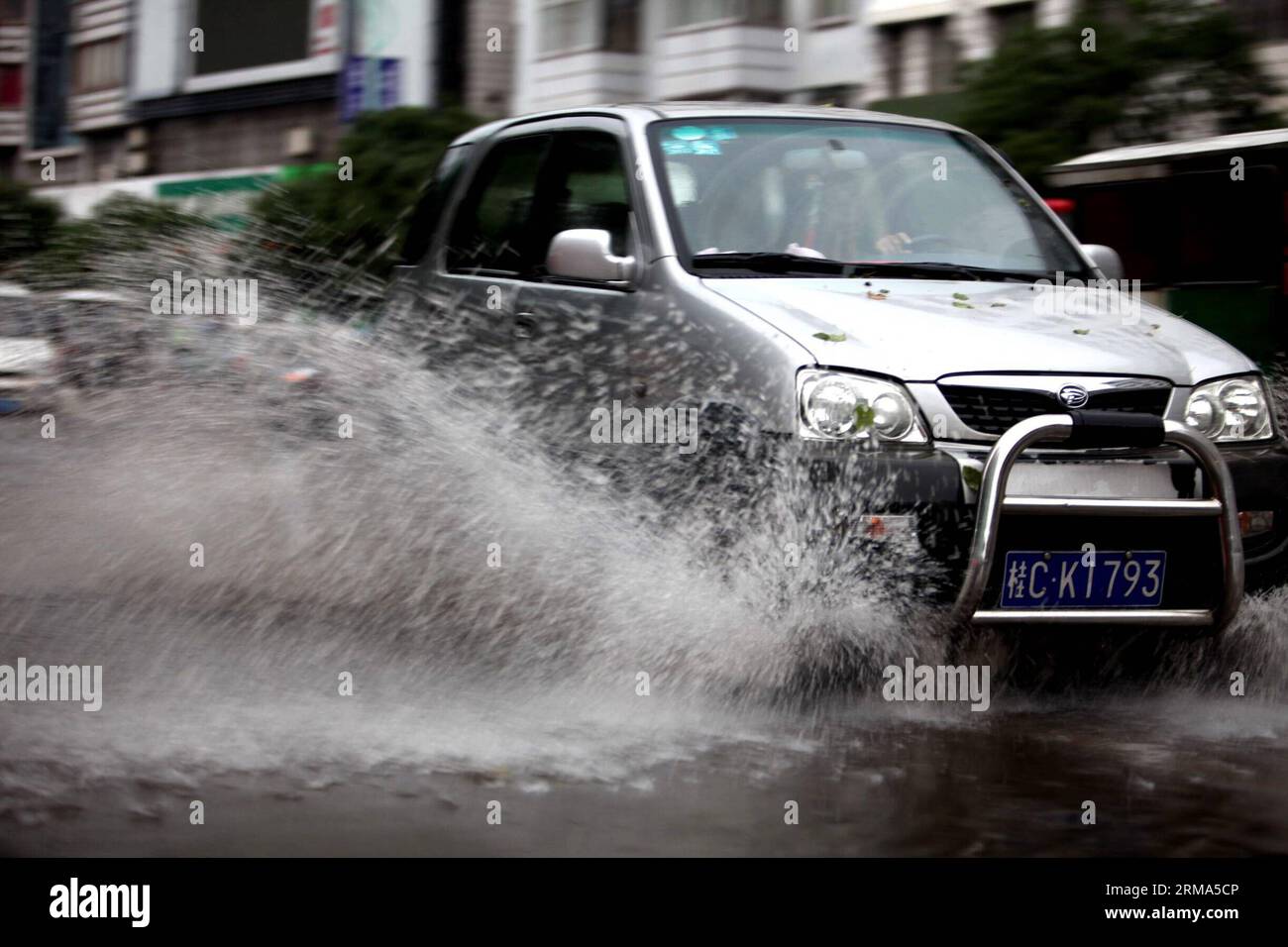 (140618) -- QUANZHOU, June 18, 2014 (Xinhua) -- A motorcar runs on a flooded road in Quanzhou County of Guilin City, south China s Guangxi Zhuang Autonomous Region, June 18, 2014. A rainstorm hit seven counties and cities of Guilin on Wednesday. (Xinhua/Wang Zichuang) (lfj) CHINA-GUANGXI-GUILIN-WATERLOGGING (CN) PUBLICATIONxNOTxINxCHN   Quanzhou June 18 2014 XINHUA a motorcar runs ON a flooded Road in Quanzhou County of Guilin City South China S Guangxi Zhuang Autonomous Region June 18 2014 a Rainstorm Hit Seven Counties and CITIES of Guilin ON Wednesday XINHUA Wang Zichuang  China Guangxi Gui Stock Photo