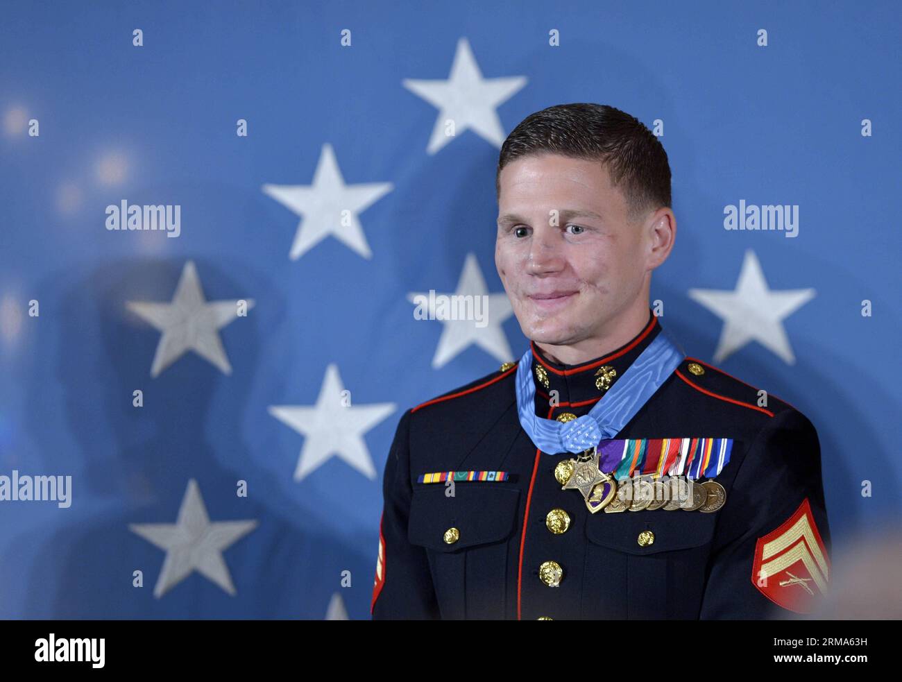 (140619) -- WASHINGTON D.C., June 19, 2014 (Xinhua) -- William Kyle Carpenter smiles after receiving the Medal of Honor from U.S. President Barack Obama during a ceremony in the East Room of the White House in Washington D.C., the United States, on June 19, 2014. Carpenter received the medal for covering a grenade to save fellow Marines during a Taliban attack in November 2010. Carpenter is the eighth living recipient chosen for the highest military award. (Xinhua/Yin Bogu) US-WASHINGTON D.C.-MEDAL OF HONOR-CARPENTER PUBLICATIONxNOTxINxCHN   Washington D C June 19 2014 XINHUA William Kyle Carp Stock Photo