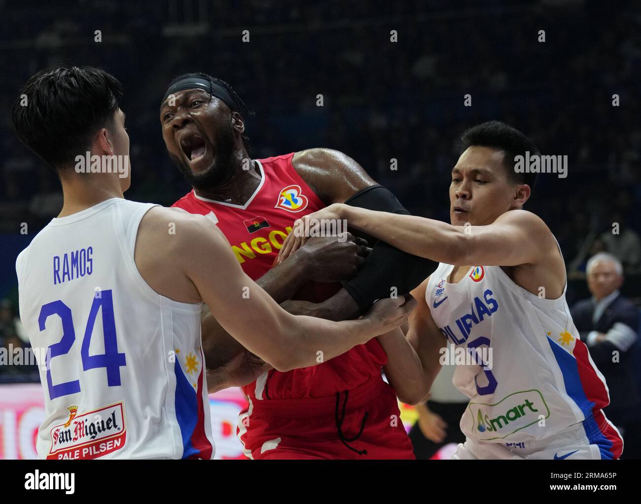 Manila, Philippines. 27th Aug, 2023. Bruno Fernando (C) of Angola tries to break through during the Group A match between the Philippines and Angola at the 2023 FIBA World Cup in Manila, the Philippines, on Aug. 27, 2023. Credit: Meng Yongmin/Xinhua/Alamy Live News Stock Photo