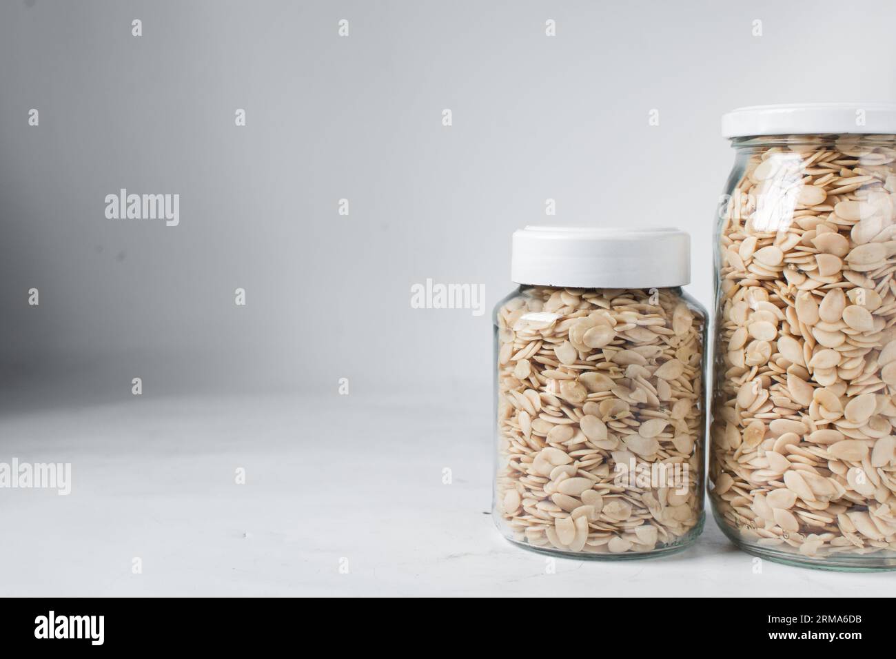 nigerian egusi seeds in a glass jar, shelled melon seeds in a