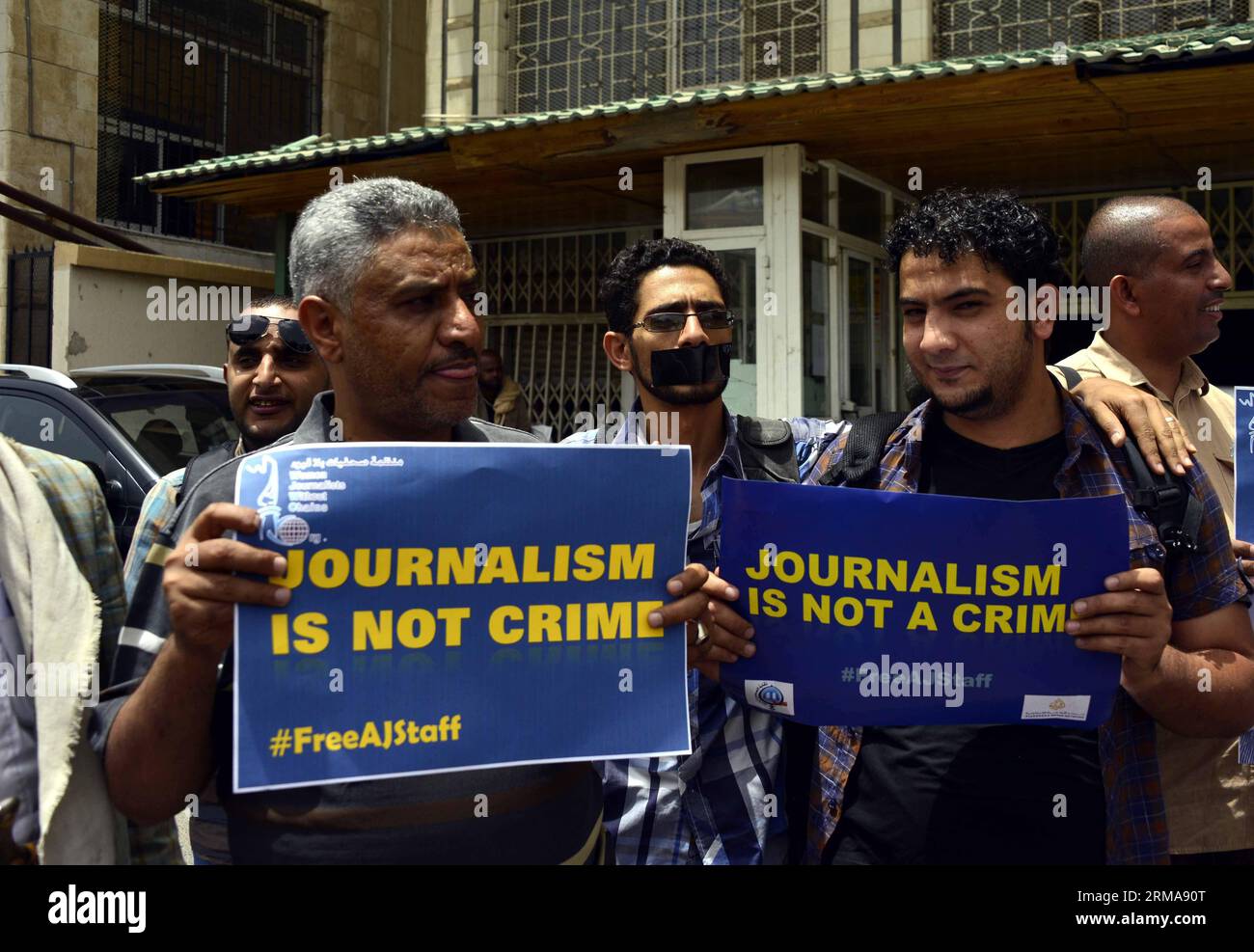 (140625) -- SANAA, June 25, 2014 (Xinhua) -- Yemeni journalists hold posters and pictures of three journalists who have been sentenced to prison by an Egyptian court during a protest in Sanaa, Yemen, June 25, 2014. An Egyptian court sentenced three Aljazeera journalists in jail over charges of aiding the outlawed Muslim Brotherhood Monday. (Xinhua/Mohammed Mohammed) YEMEN-SANAA-PROTEST-JOURNALIST PUBLICATIONxNOTxINxCHN   Sanaa June 25 2014 XINHUA Yemeni Journalists Hold Posters and Pictures of Three Journalists Who have been Sentenced to Prison by to Egyptian Court during a Protest in Sanaa Ye Stock Photo