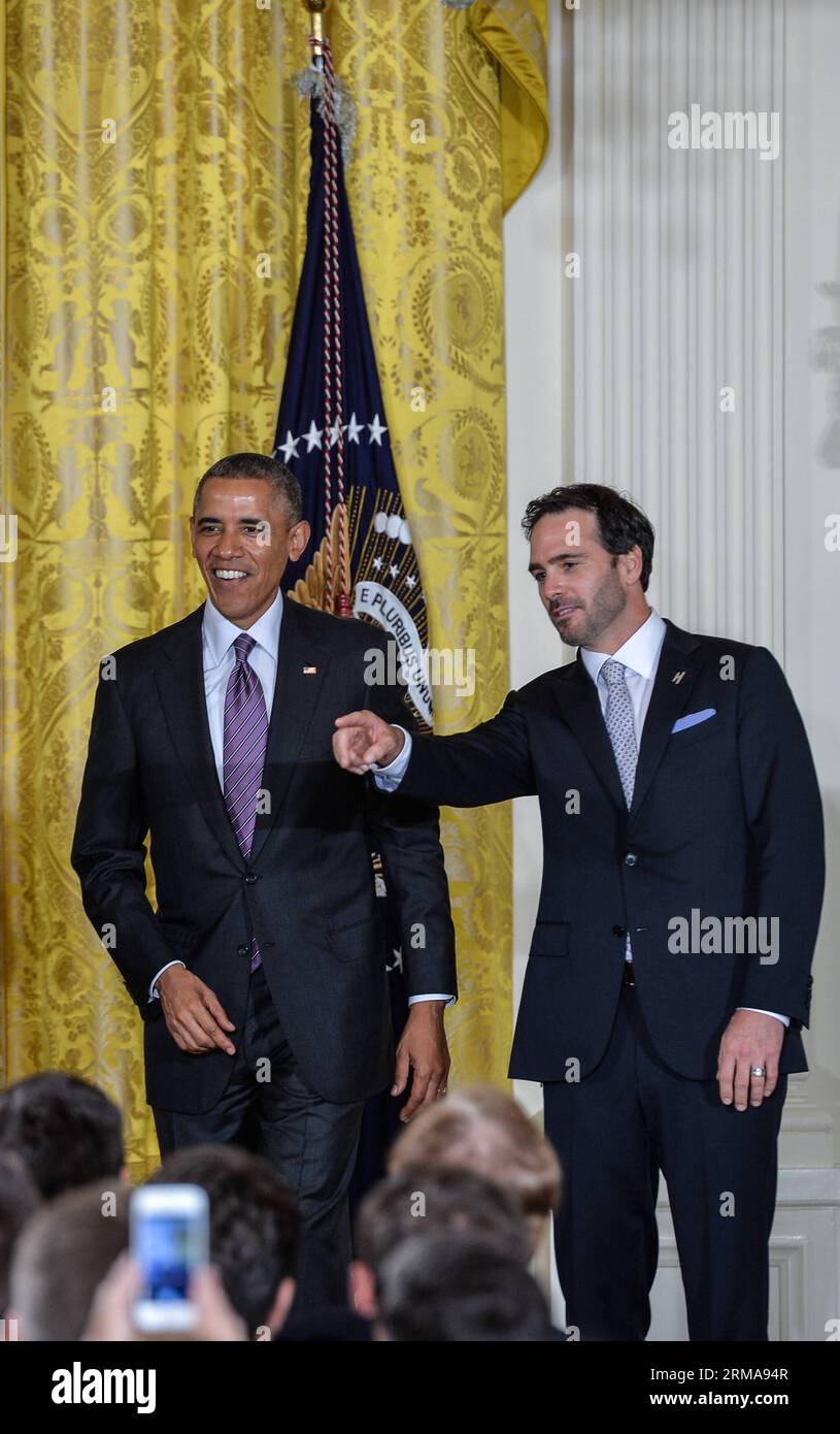 U.S. President Barack Obama (L) hosts Jimmie Johnson and the Hendrick Motorsports team members and honors their 2013 NASCAR Sprint Cup Series Championship at the White House in Washington June 25, 2014. (Xinhua/Bao Dandan) (SP)U.S.-WASHINGTON-WHITE HOUSE-NASCAR SPRINT CUP CHAMPION PUBLICATIONxNOTxINxCHN   U S President Barack Obama l Hosts Jimmie Johnson and The Hendrick Sports Team Members and Honors their 2013 NASCAR Sprint Cup Series Championship AT The White House in Washington June 25 2014 XINHUA Bao Dandan SP U S Washington White House NASCAR Sprint Cup Champion PUBLICATIONxNOTxINxCHN Stock Photo