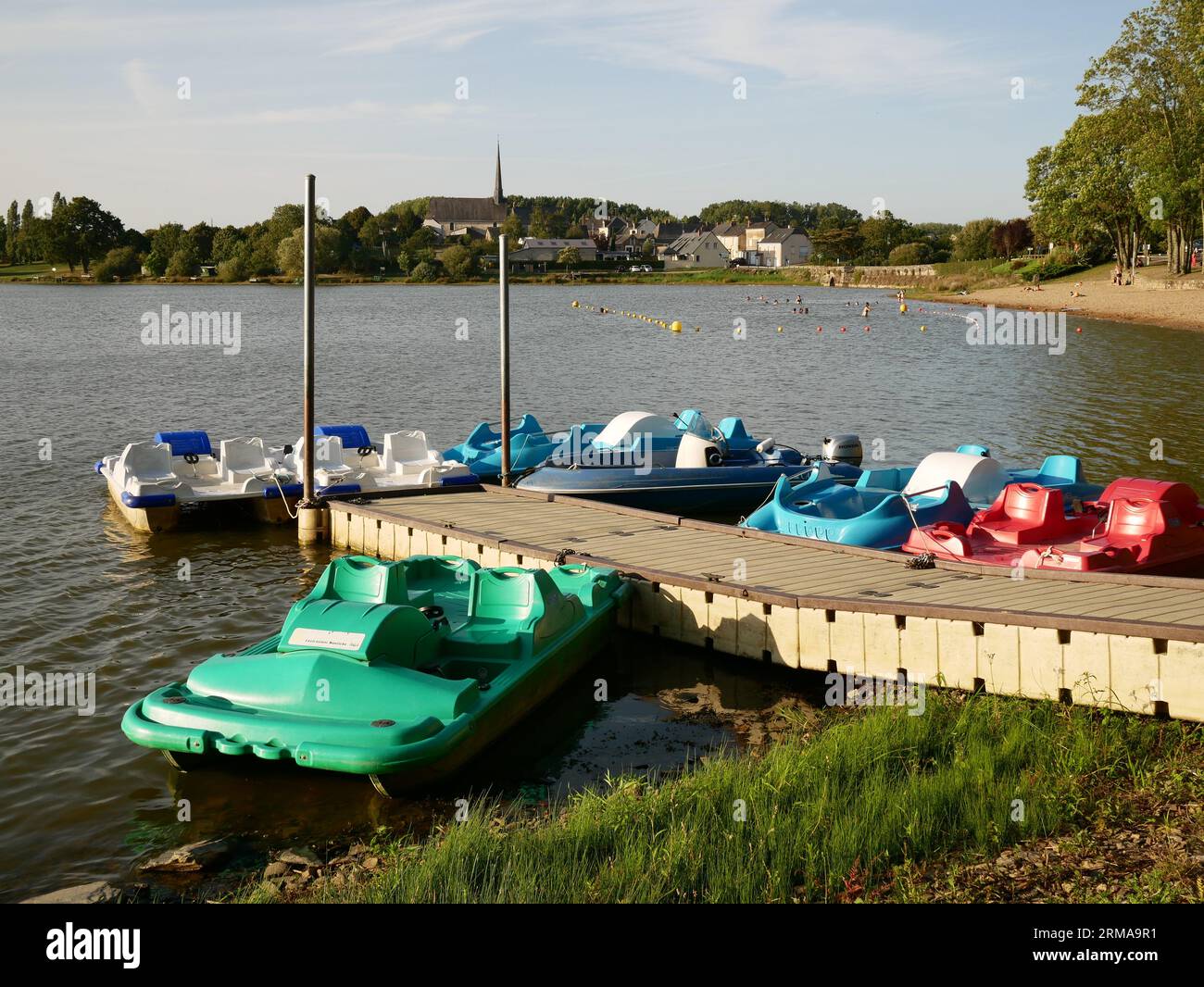 The small lake Saint Aubin at Pouance, France. With an adjacent municipal campsite it is a popular spot for swimming and watersports in the summer. Stock Photo