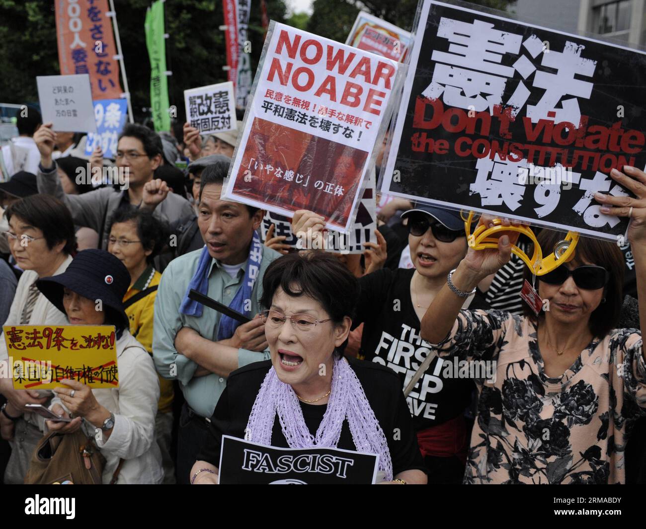 (140630) -- TOKYO, June 30, 2014 (Xinhua) -- People protest against the rights for collective self-defense in front of the Japanese Prime Minister s official residence in Tokyo, Japan, June 30, 2014. The Japanese government sought to get a green light from the Cabinet on July 1 for a resolution that will allow Japan to exercise collective self-defense rights through reinterpreting the country s pacifist Constitution. (Xinhua/Stringer) JAPAN-TOKYO-COLLECTIVE DEFENSE PUBLICATIONxNOTxINxCHN   Tokyo June 30 2014 XINHUA Celebrities Protest against The Rights for Collective Self Defense in Front of Stock Photo