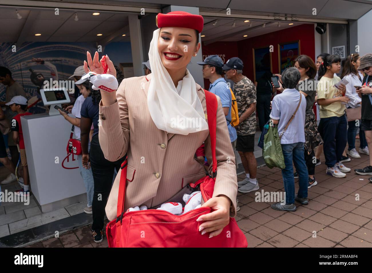 A member of Emirates airline distributes toys during Kids Day at US Open Championships at Billy Jean King Tennis Center in New York on August 26 2023 Stock Photo Alamy