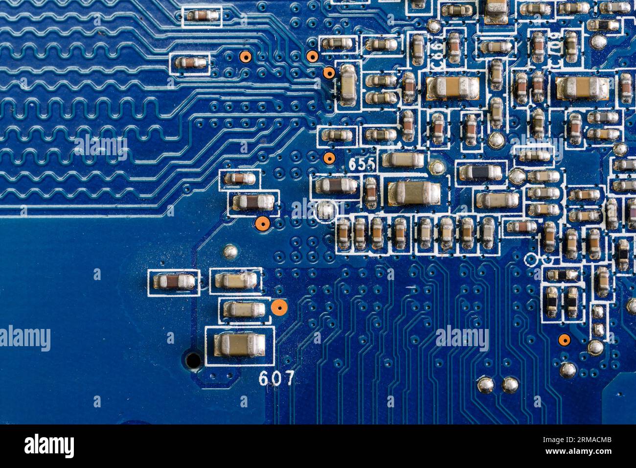 Blue Comp Computer Part A fragment of a blue computer board with capacitors Stock Photo - Alamy