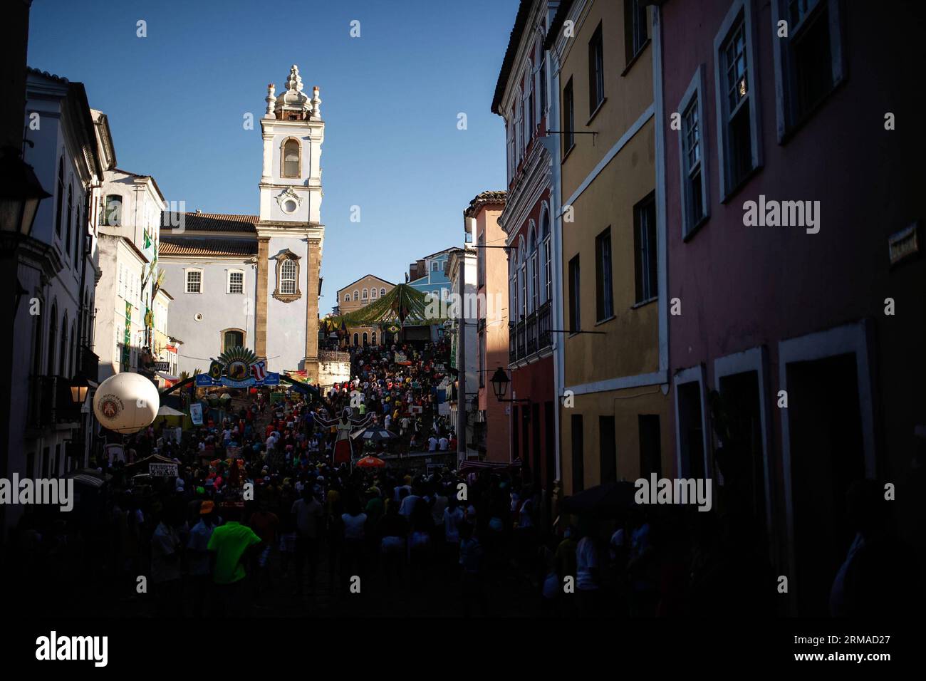 (140702) -- SALVADOR, July 2, 2014 (Xinhua) -- People walk along a street in the Historic Centre of Salvador, Brazil, on July 2, 2014. The Historic Centre of Salvador, requently called the Pelourinho, is extremely rich in historical monuments dating from the 17th through the 19th centuries, and it was named a world cultural center by UNESCO in 1985. (Xinhua/Jhon Paz) BRASIL-SALVADOR-WORD CUP 2014-TOURISM PUBLICATIONxNOTxINxCHN   Salvador July 2 2014 XINHUA Celebrities Walk Along a Street in The Historic Centre of Salvador Brazil ON July 2 2014 The Historic Centre of Salvador  called The Pelour Stock Photo
