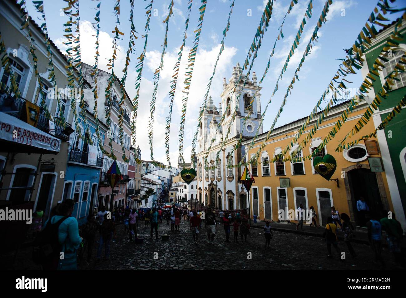 (140702) -- SALVADOR, July 2, 2014 (Xinhua) -- People walk in a street of the Historic Centre of Salvador, Brazil, on July 2, 2014. The Historic Centre of Salvador, requently called the Pelourinho, is extremely rich in historical monuments dating from the 17th through the 19th centuries, and it was named a world cultural center by UNESCO in 1985. (Xinhua/Jhon Paz) BRASIL-SALVADOR-WORD CUP 2014-TOURISM PUBLICATIONxNOTxINxCHN   Salvador July 2 2014 XINHUA Celebrities Walk in a Street of The Historic Centre of Salvador Brazil ON July 2 2014 The Historic Centre of Salvador  called The Pelourinho I Stock Photo
