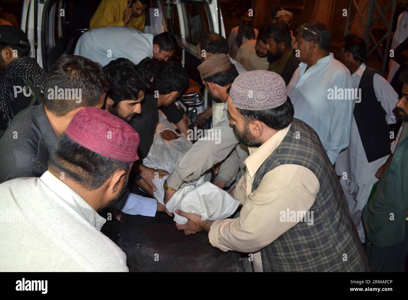 (140706) -- QUETTA, July 6, 2014 (Xinhua) -- People transfer a body of a policeman to a hospital in southwest Pakistan s Quetta on July 6, 2014. At least two policemen were killed and two others were injured as unknown gunmen opened fire on a security vehicle near Quetta, local media reported. (Xinhua/Asad) PAKISTAN-QUETTA-ATTACK PUBLICATIONxNOTxINxCHN   Quetta July 6 2014 XINHUA Celebrities Transfer a Body of a Policeman to a Hospital in Southwest Pakistan S Quetta ON July 6 2014 AT least Two Policemen Were KILLED and Two Others Were Injured As Unknown  opened Fire ON a Security Vehicle Near Stock Photo