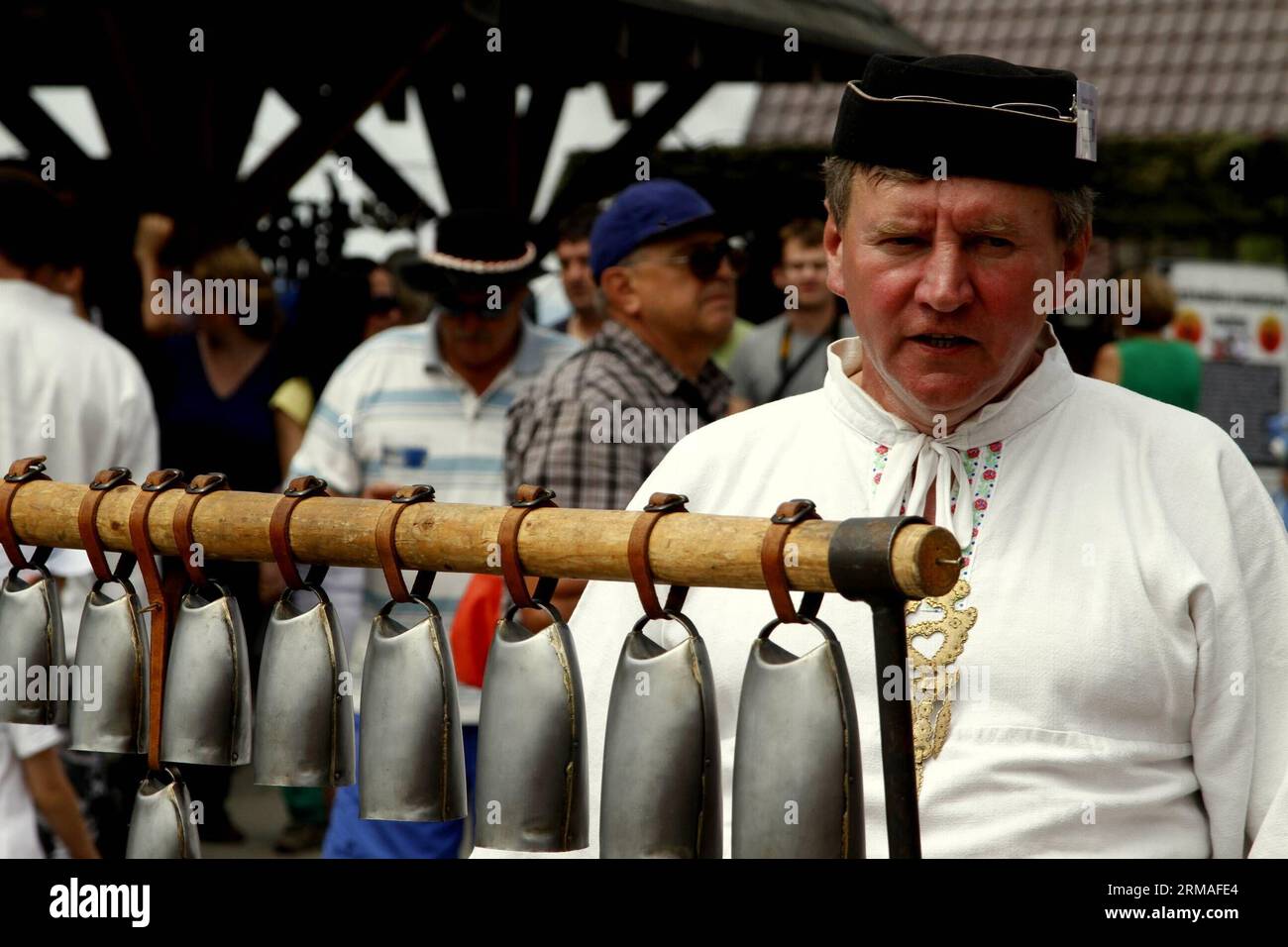 (140706) -- VYCHODNA, July 6, 2014 (Xinhua) -- A man presents bells of his own family craft during the Vychodna Folklore Festival in Vychodna, Slovakia, July 6, 2014. The Vychodna Folklore festival was held from Wednesday to Sunday to attract folklorists from Slovakia and neighboring countries. Around 1400 folklore groups appeared on the stages of the festival. (Xinhua/Erik Adamson) (zjy) SLOVAKIA-VYCHODNA-FESTIVAL PUBLICATIONxNOTxINxCHN   July 6 2014 XINHUA a Man Presents Bells of His Own Family Craft during The  Folklore Festival in  Slovakia July 6 2014 The  Folklore Festival what Hero from Stock Photo