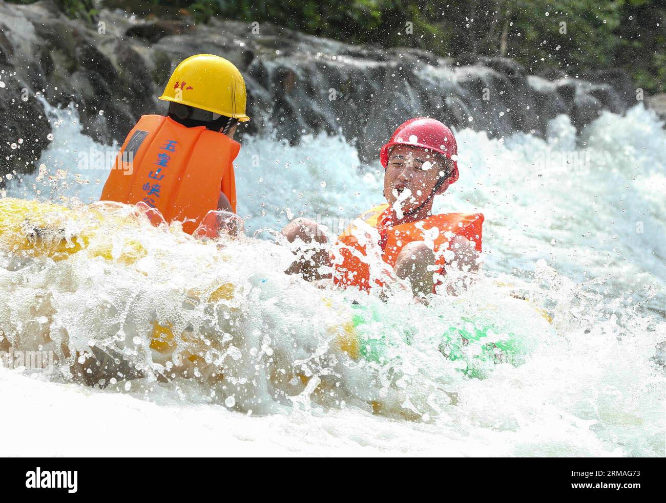 (140708) -- HUAI AN, July 8, 2014 (Xinhua) -- Tourists enjoy rafting in a valley within the Yuhuangshan Amusement Park in Heqiao Town of Xuyi County, east China s Jiangsu Province, July 8, 2014. Many people sought refuge in whitewater rafting against the summer heat. (Xinhua/Zhou Haijun) (lmm) CHINA-SUMMER-LEISURE-RAFTING (CN) PUBLICATIONxNOTxINxCHN   Huai to July 8 2014 XINHUA tourists Enjoy Rafting in a Valley Within The  Amusement Park in  Town of Xuyi County East China S Jiangsu Province July 8 2014 MANY Celebrities sought Refuge in Whitewater Rafting against The Summer Heat XINHUA Zhou Ha Stock Photo