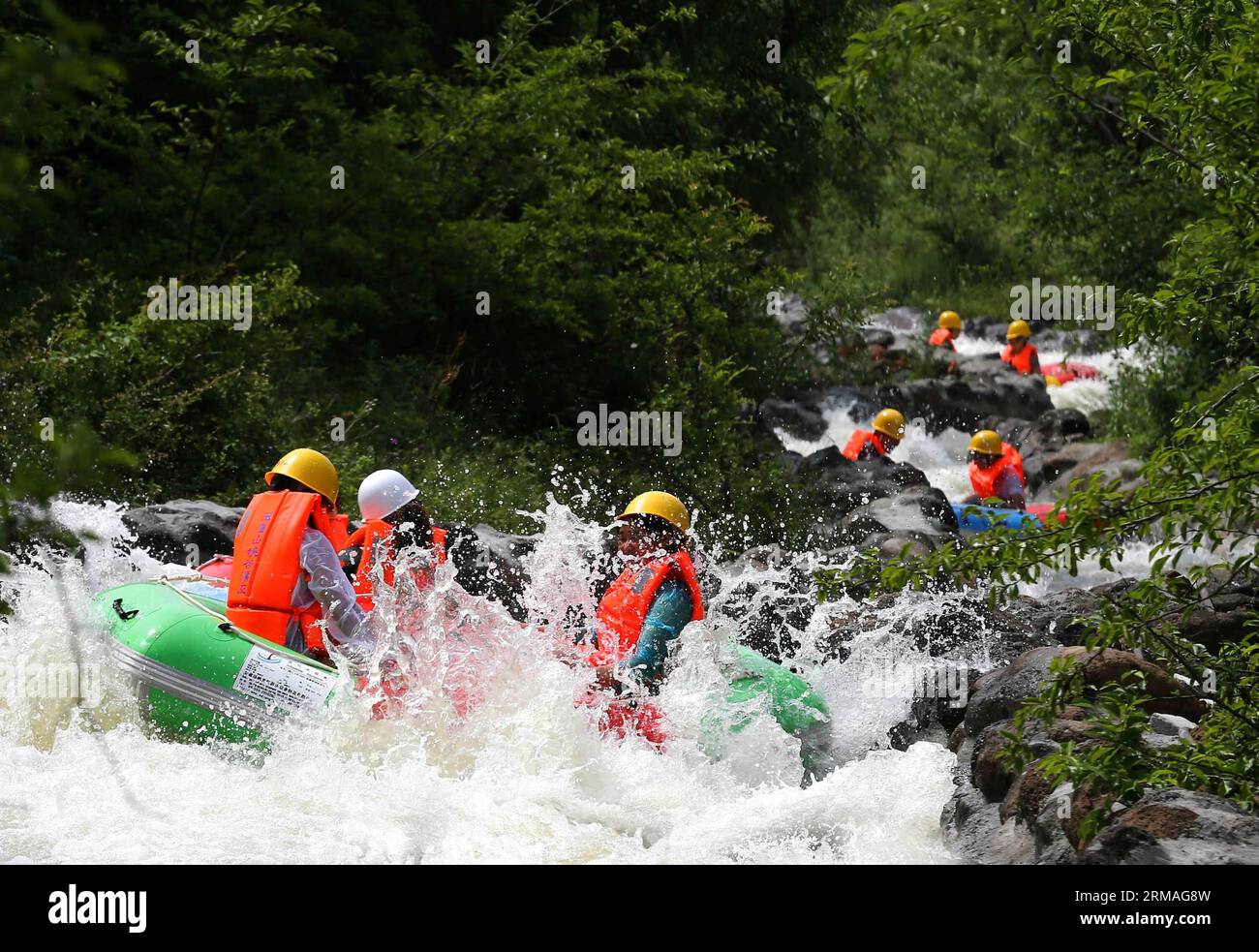 (140708) -- HUAI AN, July 8, 2014 (Xinhua) -- Tourists enjoy rafting in a valley within the Yuhuangshan Amusement Park in Heqiao Town of Xuyi County, east China s Jiangsu Province, July 8, 2014. Many people sought refuge in whitewater rafting against the summer heat. (Xinhua/Zhou Haijun) (lmm) CHINA-SUMMER-LEISURE-RAFTING (CN) PUBLICATIONxNOTxINxCHN   Huai to July 8 2014 XINHUA tourists Enjoy Rafting in a Valley Within The  Amusement Park in  Town of Xuyi County East China S Jiangsu Province July 8 2014 MANY Celebrities sought Refuge in Whitewater Rafting against The Summer Heat XINHUA Zhou Ha Stock Photo