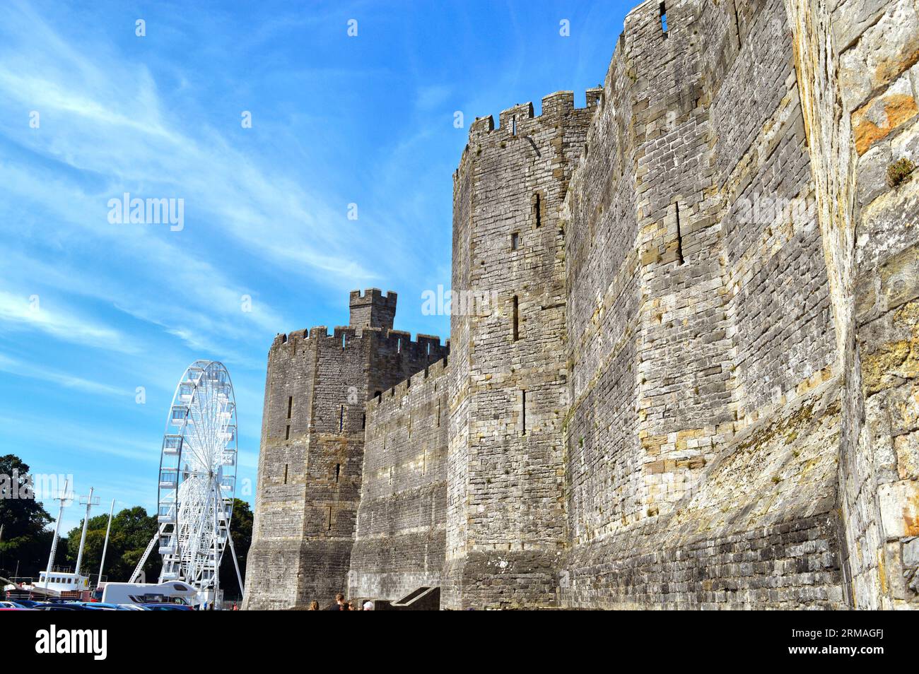 Caernarfon castle tower, Wales UK- August 17, 2023 :   Caernarfon castle, the Middle Ages, is a fortress-palace on the banks of the River Seiont Stock Photo