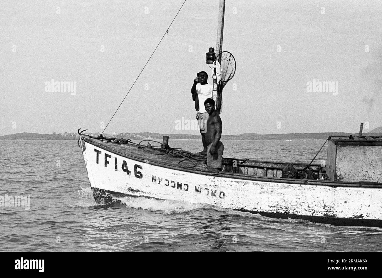 Small trawler at sea off Winneba, Ghana. Fishing among a fleet of sea