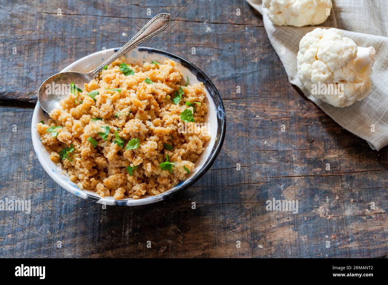 Spiced cauliflower rice with fresh coriander Stock Photo Alamy