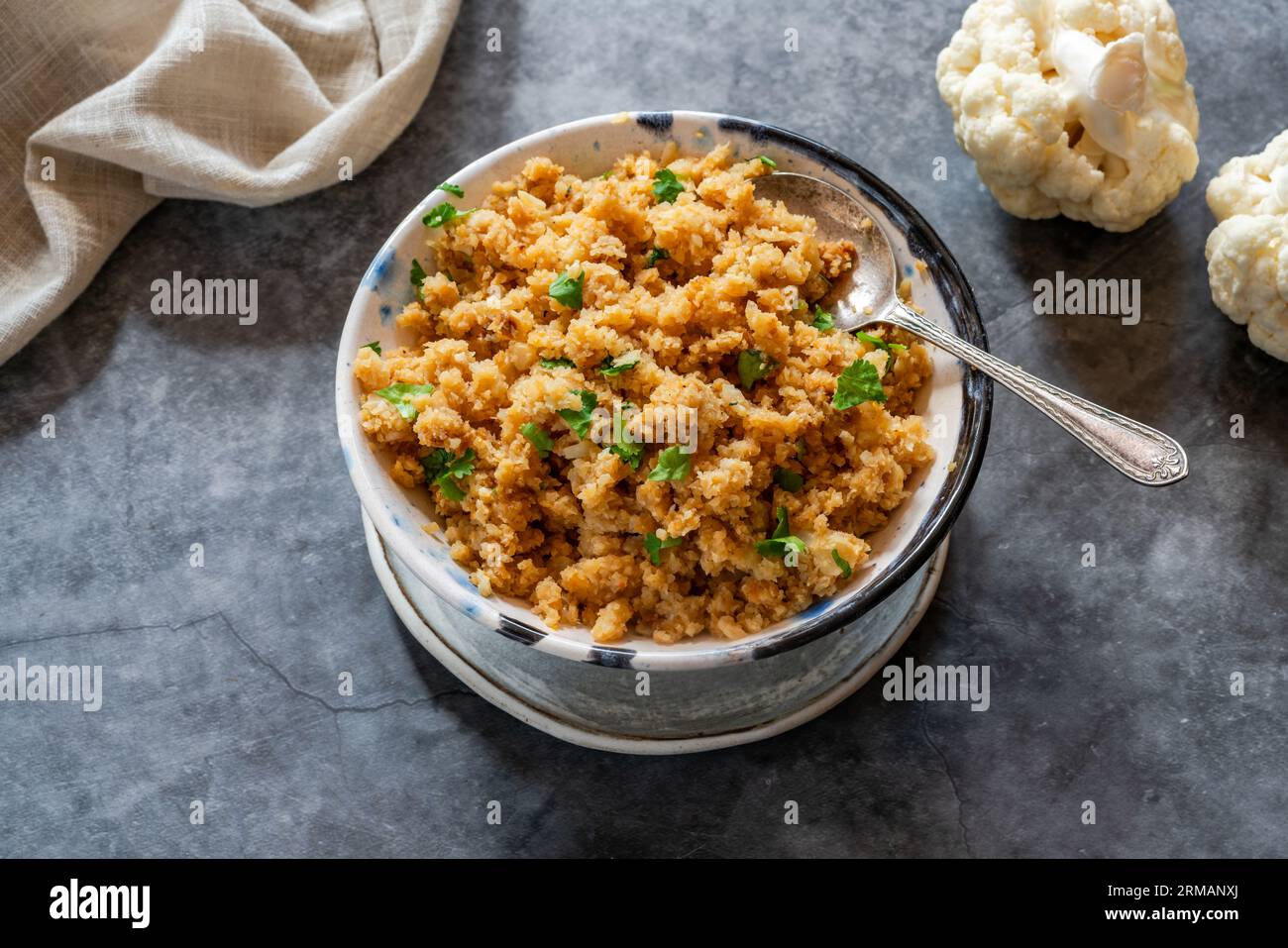 Spiced cauliflower rice with fresh coriander Stock Photo Alamy