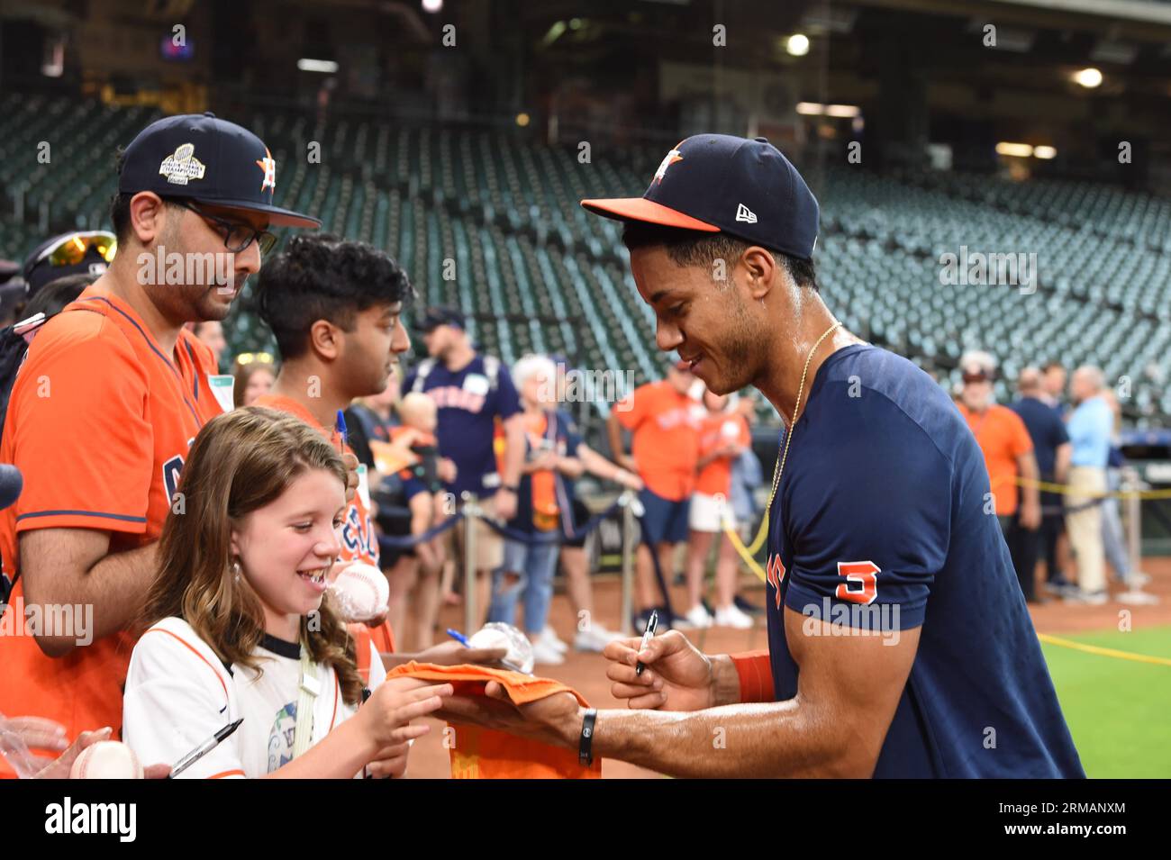 Houston Astros shortstop Jeremy Pena (3) signs an autograph for an adoring fan before the MLB game between the Boston Red Sox and the Houston Astros o Stock Photo