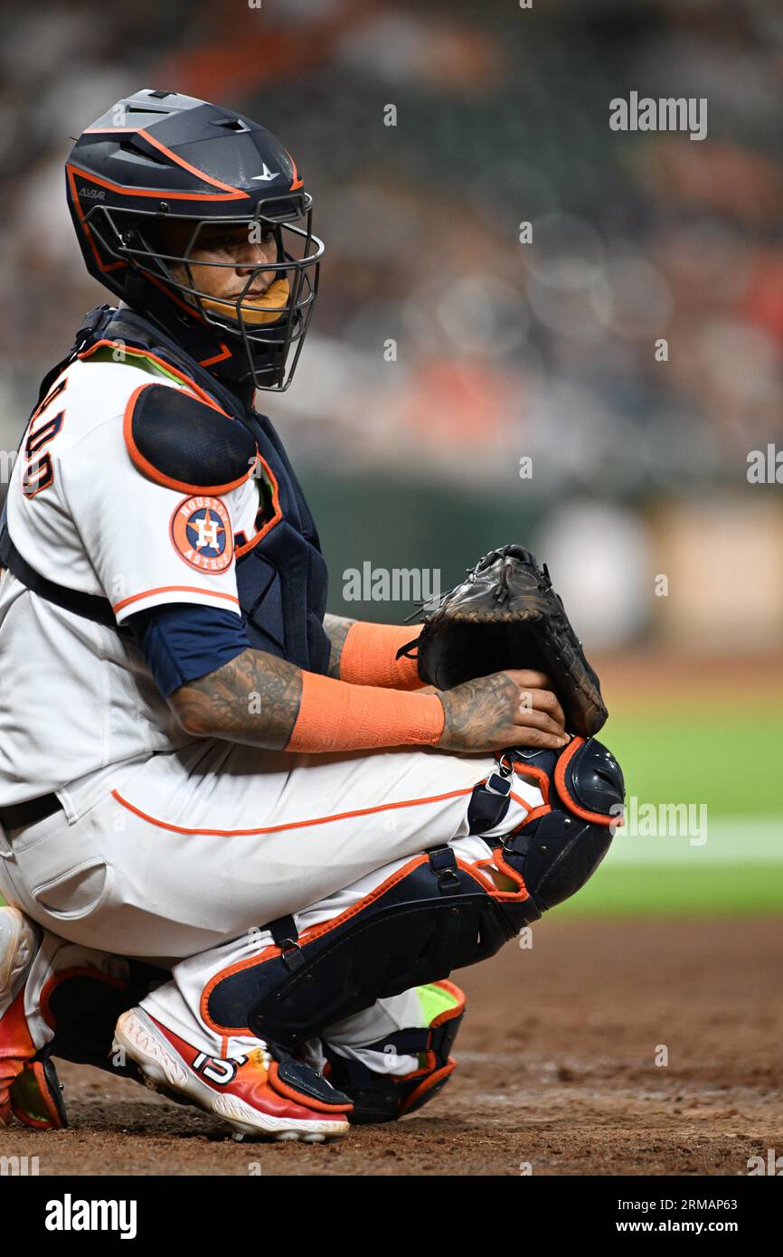 Houston Astros catcher Martin Maldonado (15) sending a pitch signal in the ninth inning of the MLB game between the Boston Red Sox and the Houston Ast Stock Photo