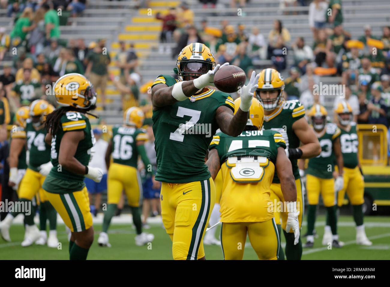 Green Bay Packers linebacker Quay Walker (7) heads to the end zone for a  touchdown after he intercepted a pass by Chicago Bears quarterback Justin  Fields during the second half of an