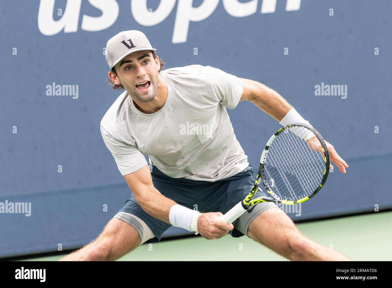 Eliot Spizzirri of USA returns ball during final round match against Emilio Nava of USA of qualifying for US Open Championships at Billy Jean King Tennis Center in New York. Stock Photo