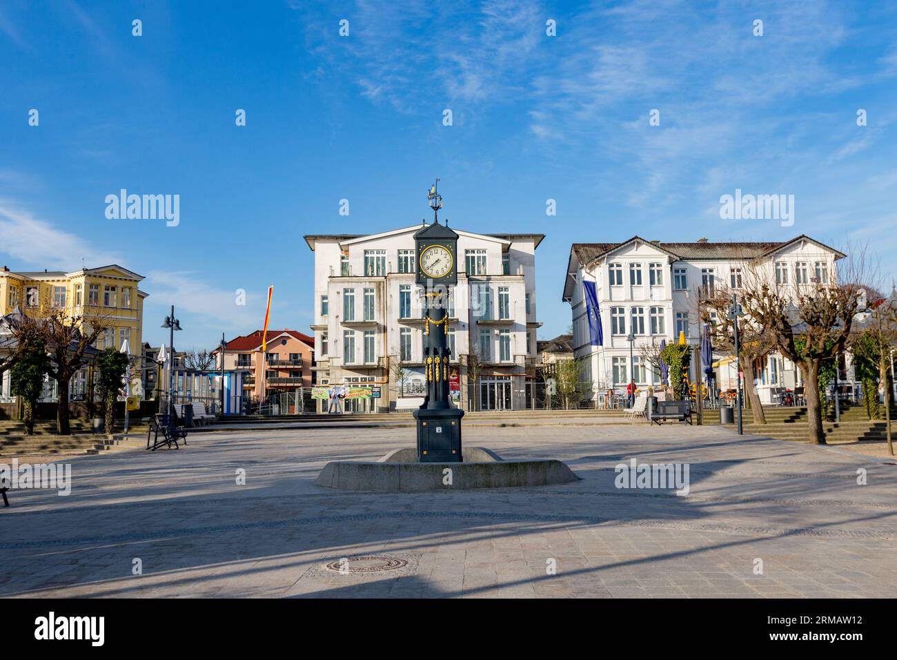Ahlbeck, Germany - April 17, 2014: old clock tower at the scenic promenade with historic in wilhelminian style hotels in Ahlbeck, Germany. Stock Photo
