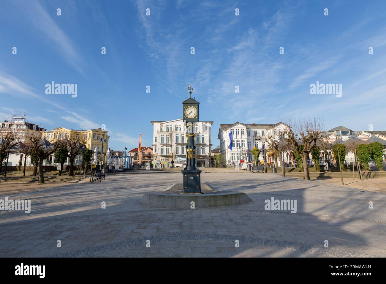 Ahlbeck, Germany - April 17, 2014: old clock tower at the scenic promenade with historic in wilhelminian style hotels in Ahlbeck, Germany. Stock Photo