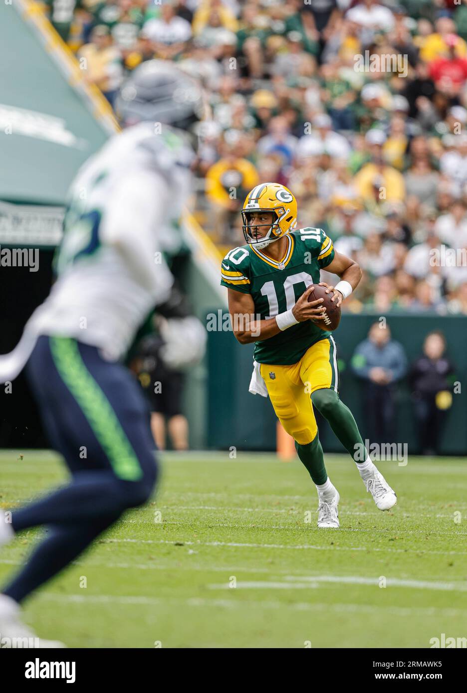 Green Bay Packers quarterback Jordan Love (10) rolls out of the pocket  during the second half of a preseason NFL football game against the Seattle  Seahawks Saturday, Aug. 26, 2023, in Green