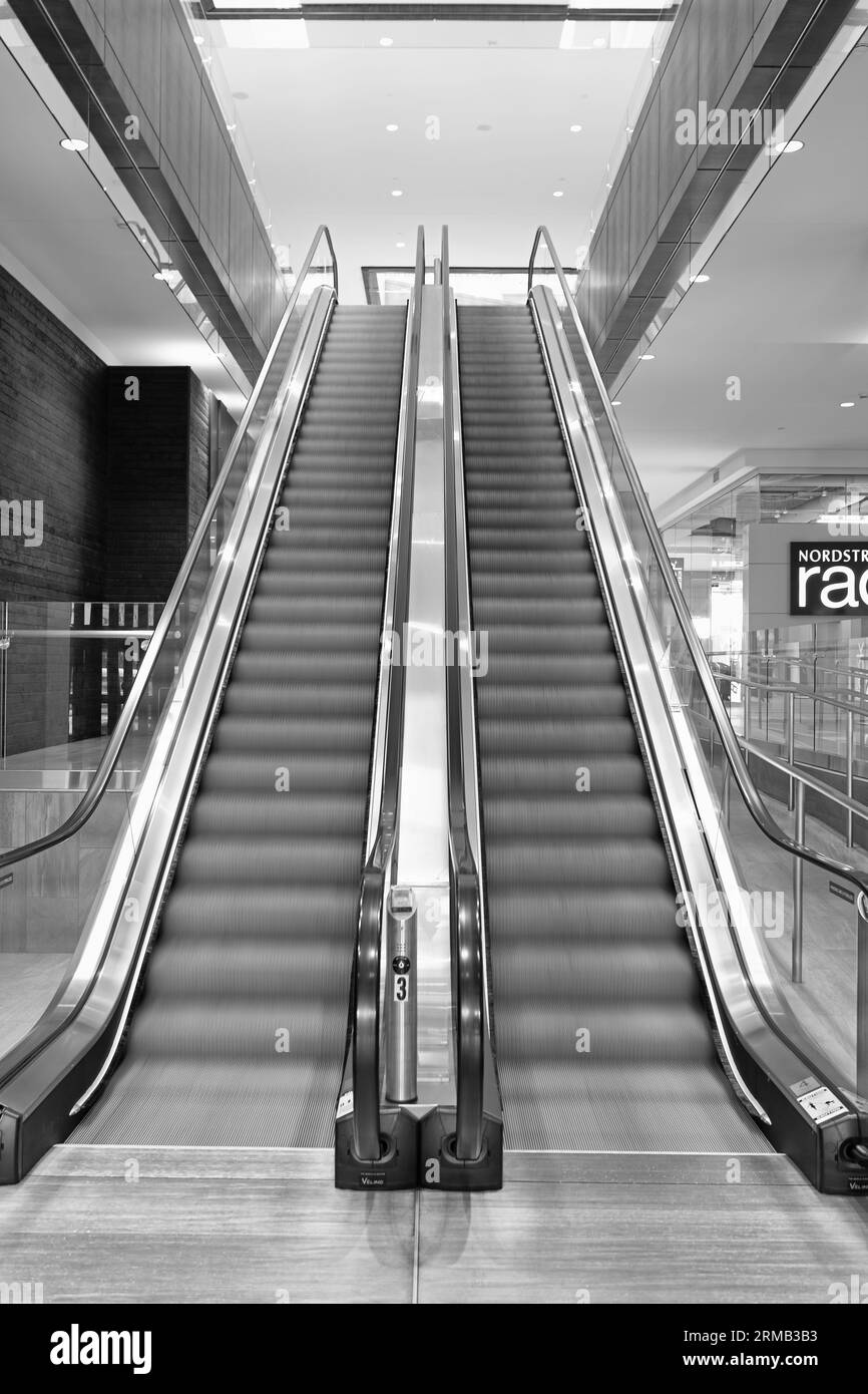 Seattle, Washington D.C. USA - April 02, 2021: modern escalators with moving staircase Stock Photo