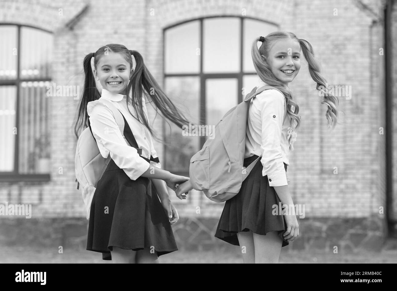 happy two school girls best friends together outdoor Stock Photo - Alamy